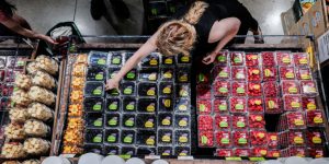 FILE PHOTO: People shop for groceries at a store in New York City, U.S., July 15, 2025. REUTERS/Jeenah Moon/File Photo